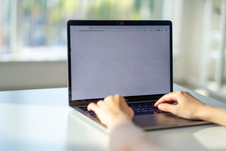 IT worker checking a backup status screen in an office