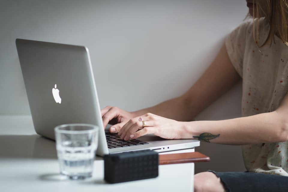 Office worker checking business email at a desk