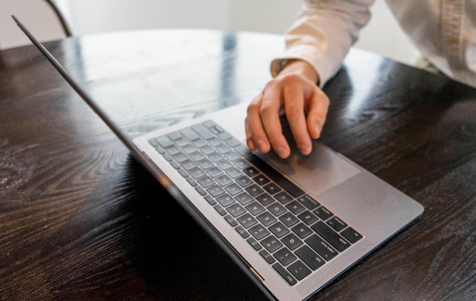 Engineer reviewing rising website traffic graphs on a monitor