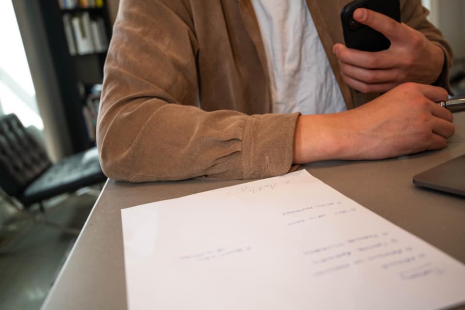 Manager reviewing data agreements in an office