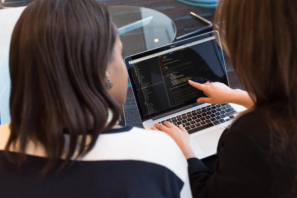 Security engineer reviewing blocked web request logs on screen